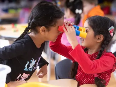 Two children playing with toys